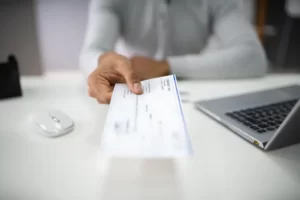 Can you deposit an estate check into a personal account feature image